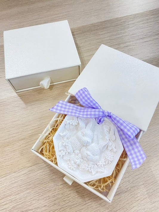 Box with plaster rabbit