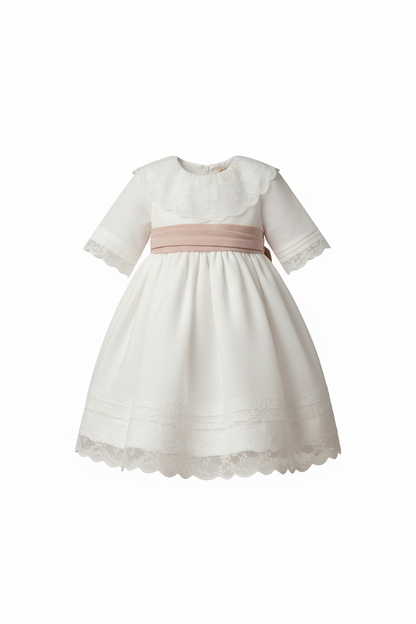 White linen dress with lace collar, dry pink sash